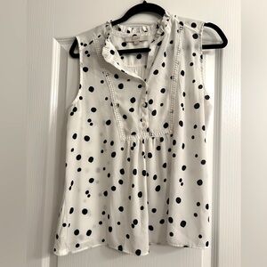 White and navy polka dot blouse